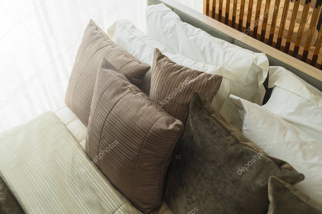 close up white beige soft pillows on bed and blanket bedroom interior design concept.bed maid luxury ideas concept