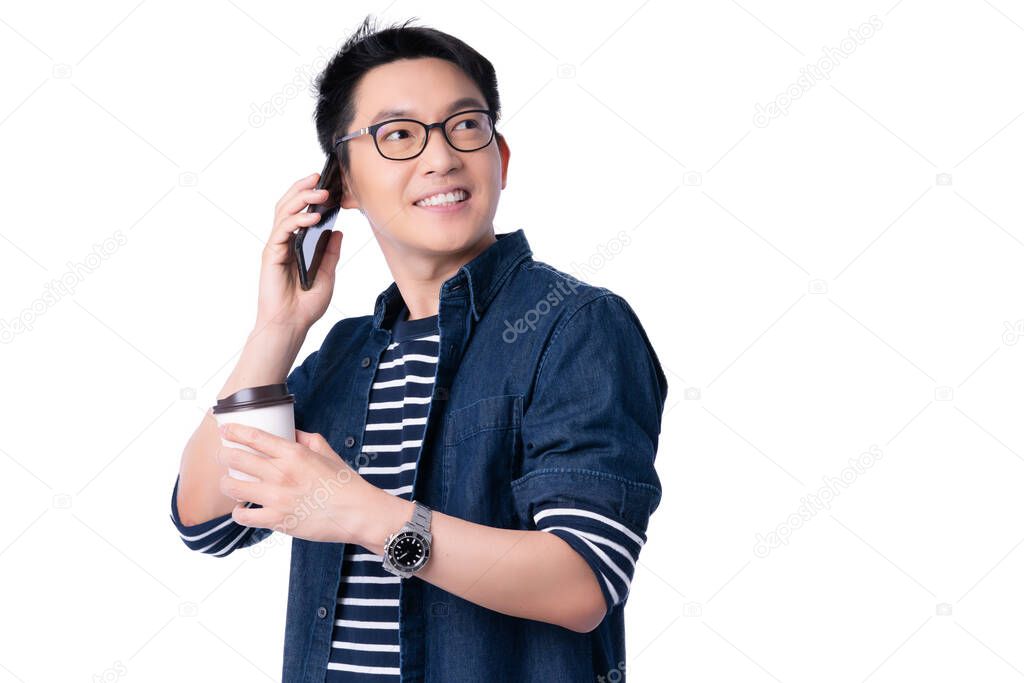smart attractive asian glasses male hand hold hot drink coffee with freshness and joyful casual dress portrait white background hand communication with smartphone