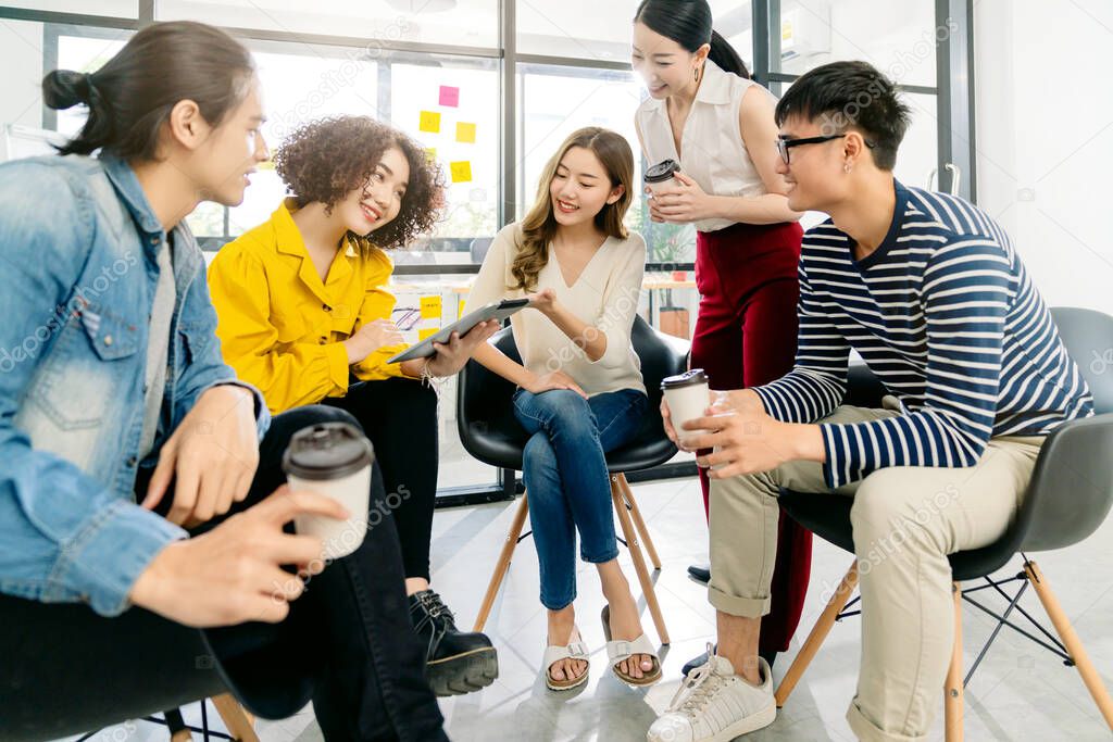 Group of asian young creative happy people entrepreneur on a business meeting office background Good leadership and teamwork lead to success