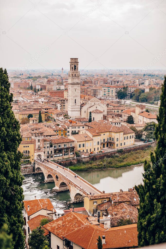 View of arched bridge Ponte Pietra over the Adige River in the Italian city of Verona