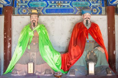 HEBEI, CHINA - Oct 13 2015: Statues of Pang Tong and Zhuge Liang at Sanyi Temple. a famous historic site in Zhuozhou, Hebei, China. clipart