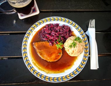 Bavarian Sauerbraten of beef, bread dumplings clipart