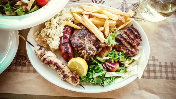 Mix meat plate with french fries — Stock Photo, Image