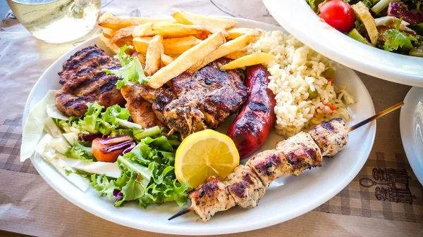 Mix meat plate with french fries — Stock Photo, Image