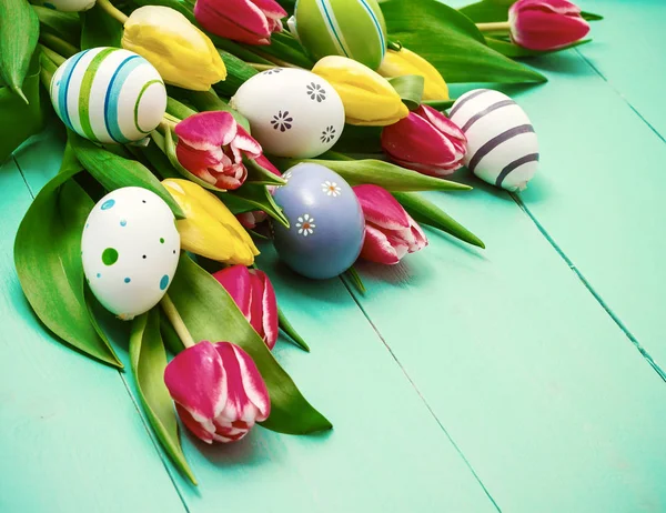 Tulips with colorful Easter eggs — Stock Photo, Image