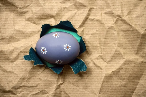 Lilac Eastern egg in hole  brown wrapping paper