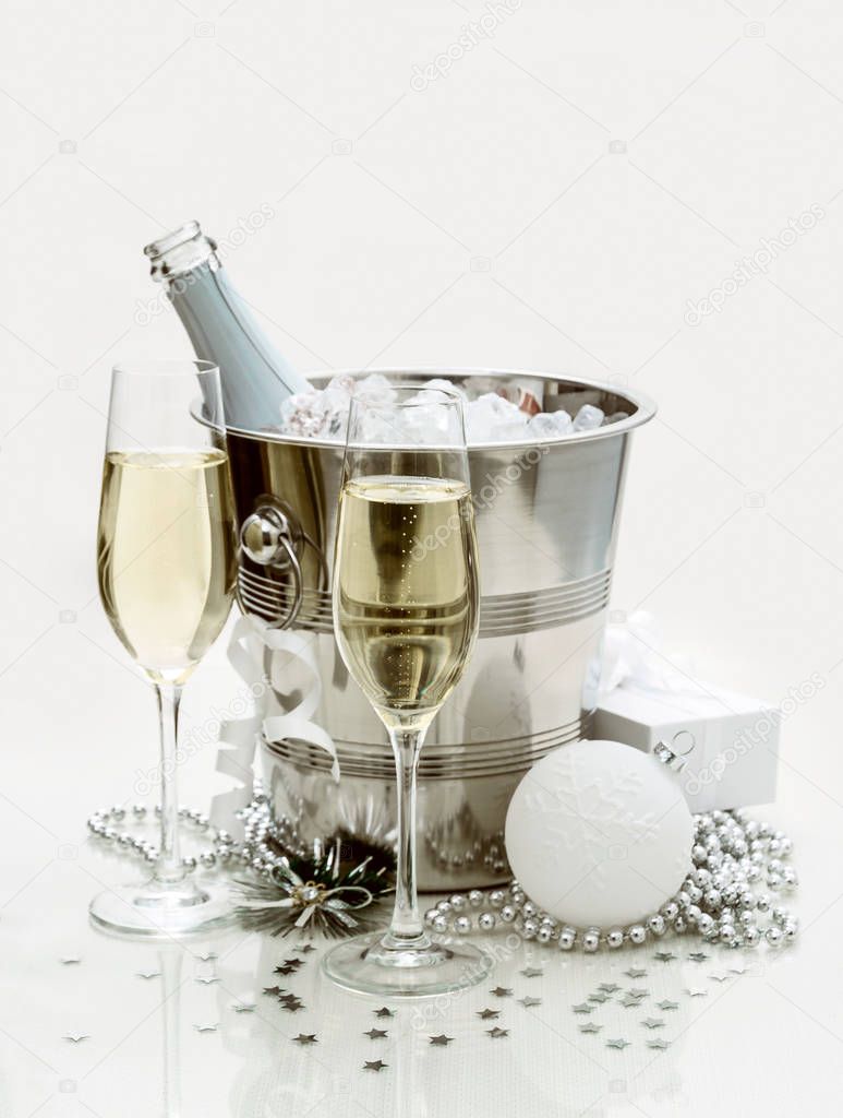 Two champagne glasses, cooler