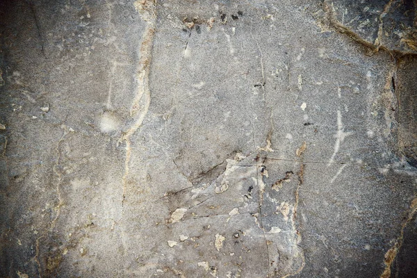 Schmutzige, zerkratzte alte Steinmauer — Stockfoto