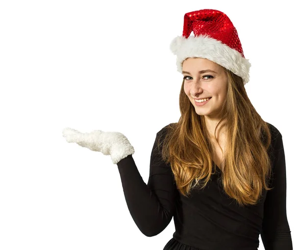 Niedliches Weihnachtsmädchen, das etwas auf offener Hand präsentiert, isoliert — Stockfoto