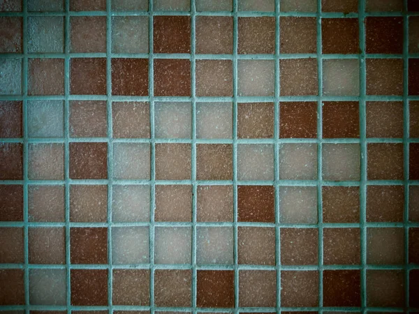 Dirty, tiled old mosaic wall, soft focus Royalty Free Stock Images