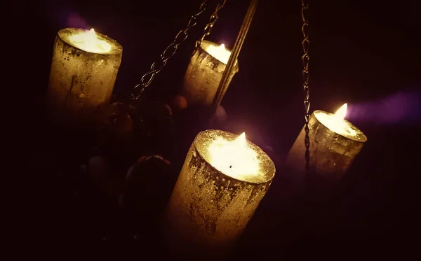 Magic candle light on chains — Stock Photo, Image