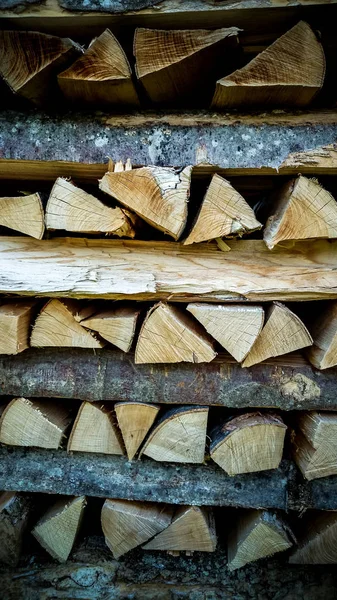 Neatly stacked firewood as background — Stock Photo, Image