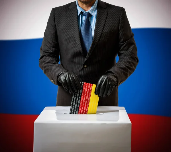 Hombre con guante lanza bandera alemana en caja de voz — Foto de Stock