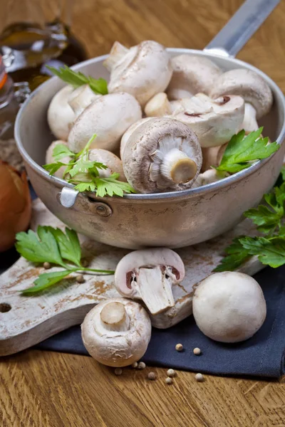 Fresh champignon mushrooms on wooden — Stock Photo, Image