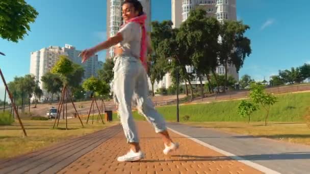 Smiling mixed race female have fun outdoors cityscape background sunlight — Stockvideo