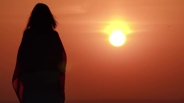 Female enjoy orange sky with rising sun — Stockvideo