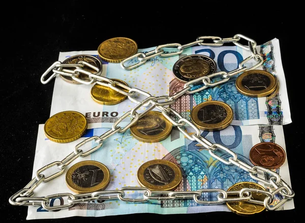 Euro currency in chains — Stock Photo, Image