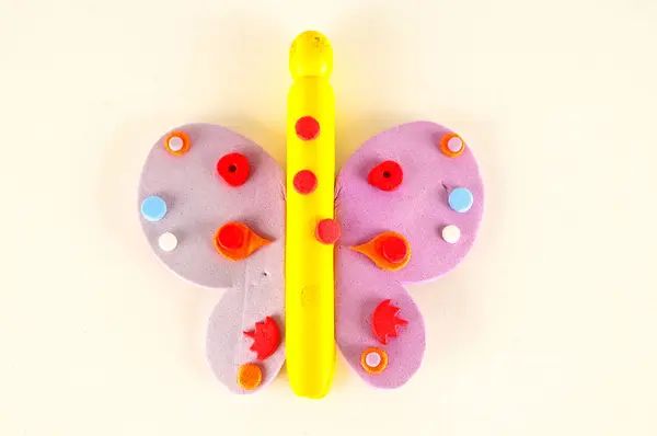 Close-up of plastic colored toy butterfly — Stock Photo, Image