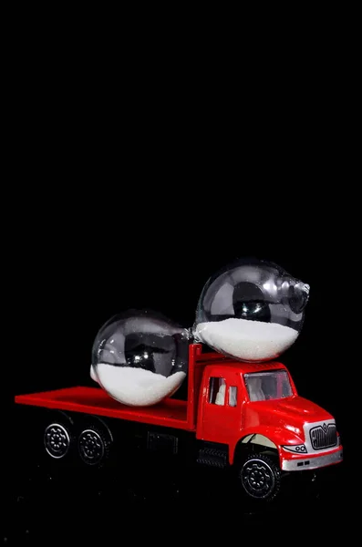 Time Transportation Concept Hourglass Watch Red Toy Truck Black Background — Stock Photo, Image
