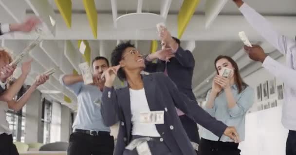 Excited business staff celebrating victory and dancing at modern business office. Young happy office workers throwing money and rejoicing. Concept of successful business and fortune. — 비디오