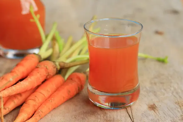 Fresh carrot with juices — Stock Photo, Image