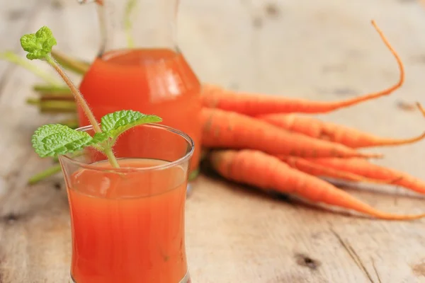 Fresh carrot with juices — Stock Photo, Image