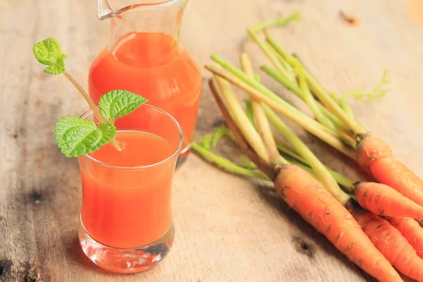 Fresh carrot with juices — Stock Photo, Image