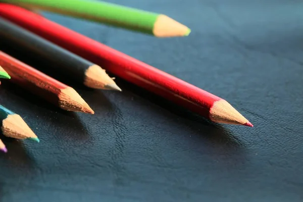 Colored pencils on wood background — Stock Photo, Image