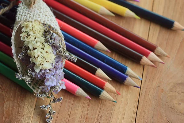 Colored pencils on wood background — Stock Photo, Image