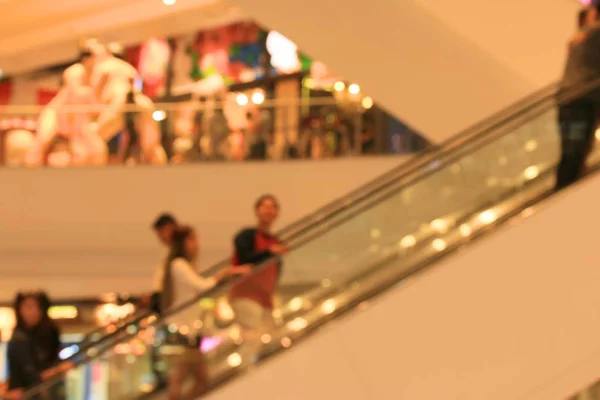 Blurred people in shopping mall — Stock Photo, Image