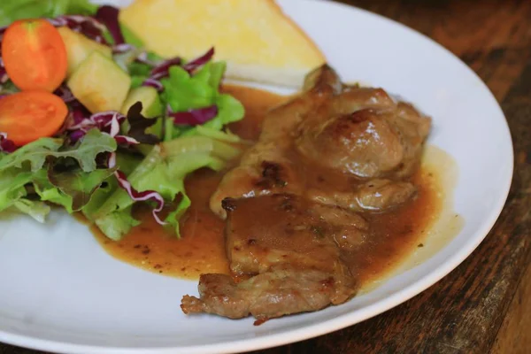 Pork steak with salad — Stock Photo, Image