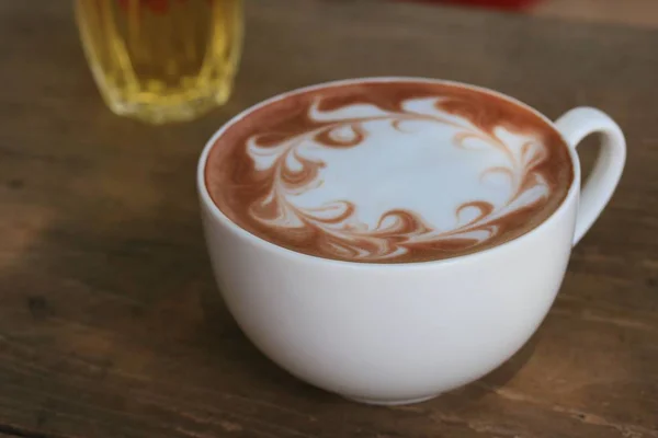 Hot coffee on wood background — Stock Photo, Image