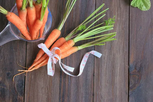 Fresh carrot on wood — Stock Photo, Image