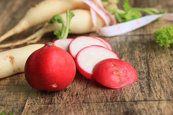 Red radish with tape measure