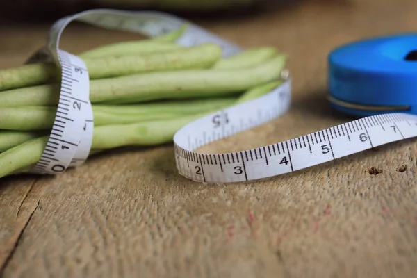 long bean with tape measure