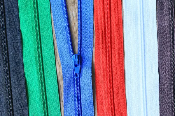 Zipper on wood background — Stock Photo, Image