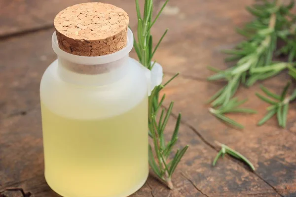 Rosemary herbs with oil — Stock Photo, Image