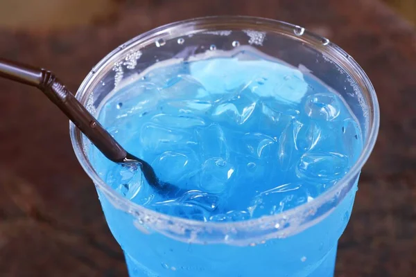 Blue soda drinking water