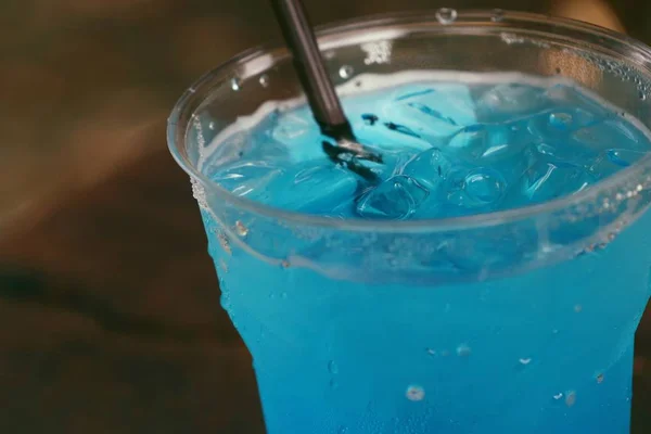 Blue soda drinking water