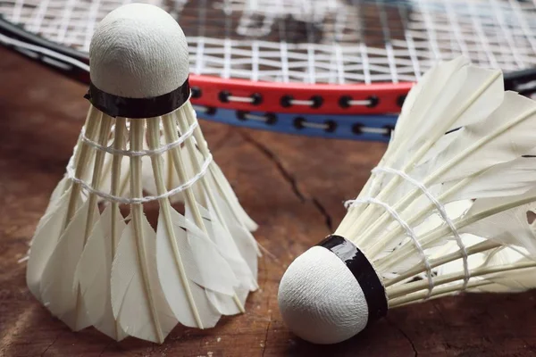 Shuttlecocks with badminton racket