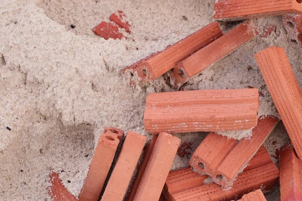 Brick in the pile of sand — Stock Photo, Image