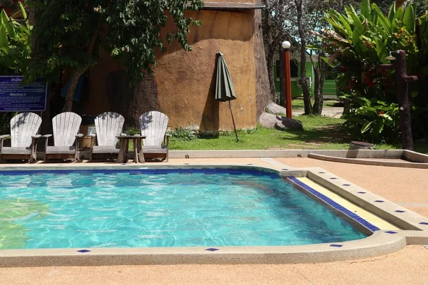 Swimming pool with chair — Stock Photo, Image