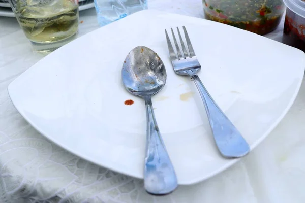 Spoon and fork in partry — Stock Photo, Image