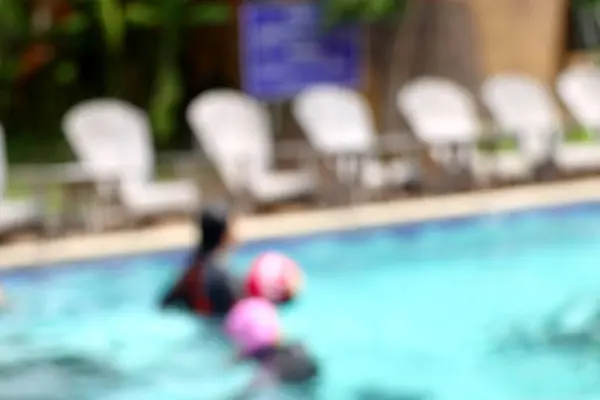 Blurred kid swimming pool — Stock Photo, Image