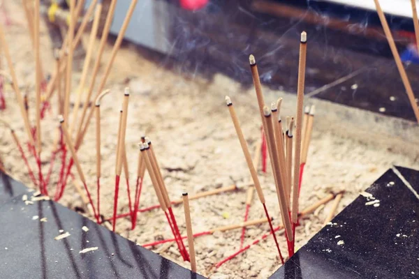 Incense burning on sand — Stock Photo, Image