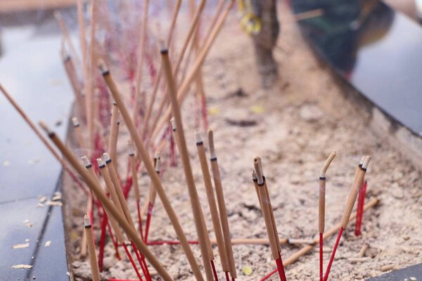 incense burning on sand