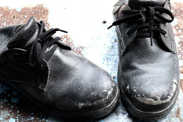 Old black leather shoes — Stock Photo, Image