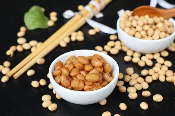 Salted soy beans on black background — Stock Photo, Image