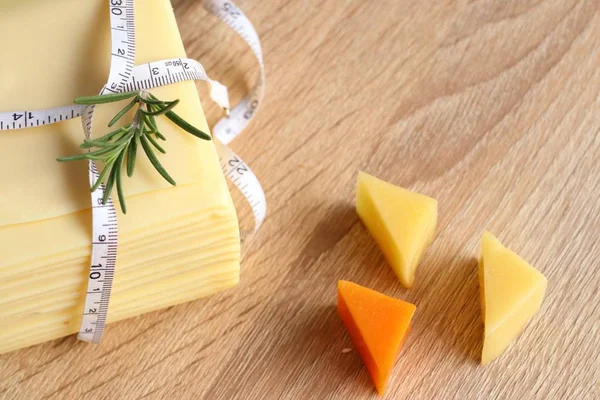 Piece and slices of cheese — Stok fotoğraf