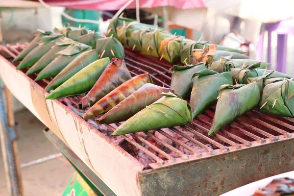 Sticky rice wrapped in banana leaves — Stock Photo, Image